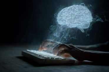 This shows a person typing and a brain with code in it.