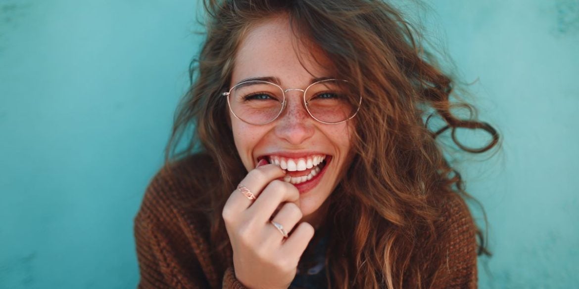 This shows a woman chewing her fingernails.
