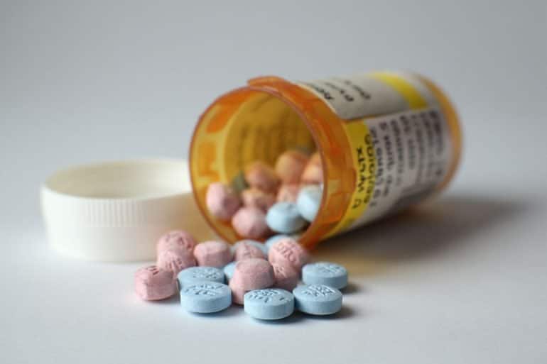 This shows an open pill bottle.