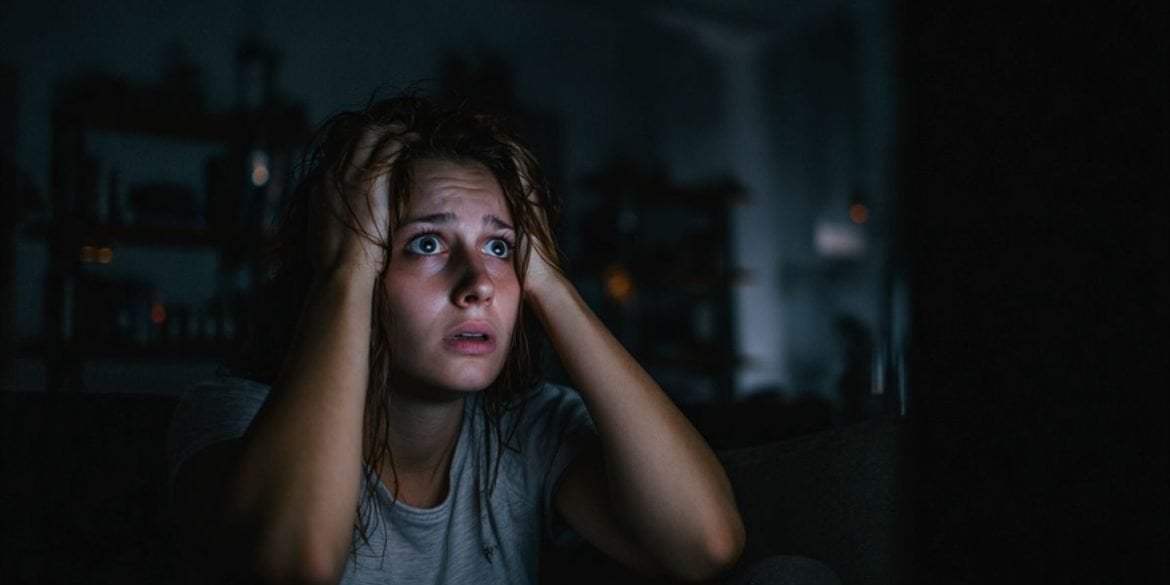 This shows a person holding their head while watching a movie.