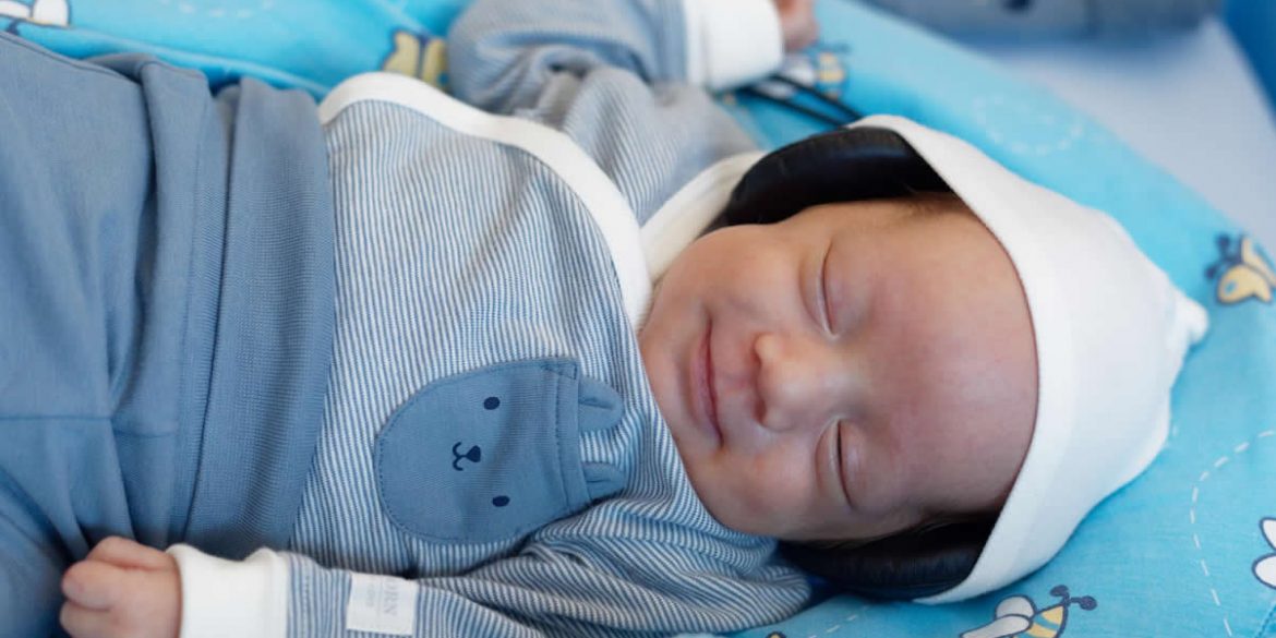 This shows a preterm baby listening to music