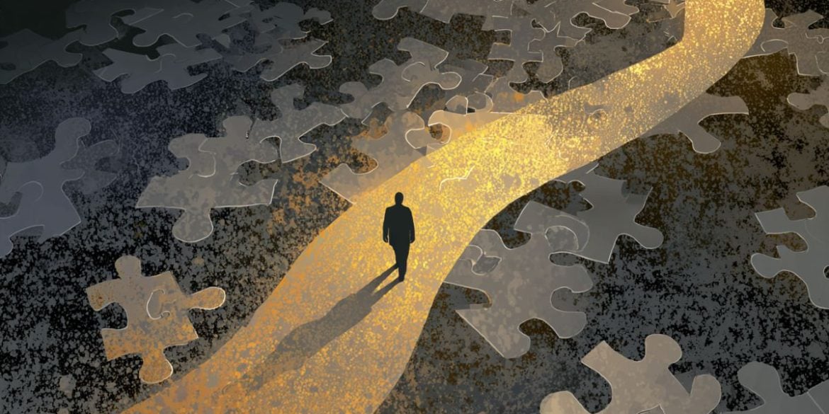 This shows a person walking on a path with scattered puzzle pieces at his feet.